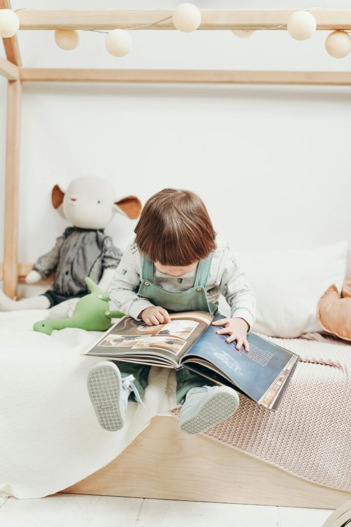 Adorable child reading a book in a cozy playroom, surrounded by toys. Perfect for early learning themes.
